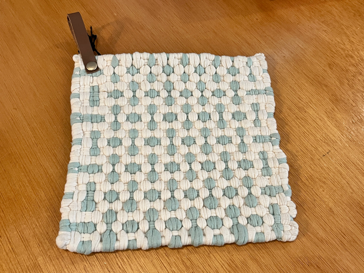 2 color woven pot holders, leather strap